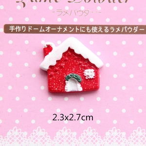 Macro detail of a resin Christmas house charm for DIY crafts with glitter finish