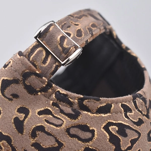Macro detail of leopard print baseball cap with adjustable silver metal buckle at the back