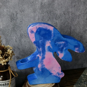 Detail of bunny hydroponic vase mold featuring blue and pink marble resin texture
