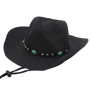 Detail of black straw cowboy hat with turquoise beads and adjustable wind rope