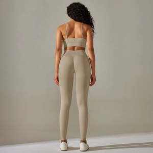 Detailed back view of khaki seamless yoga set with double straps and ribbed fabric texture