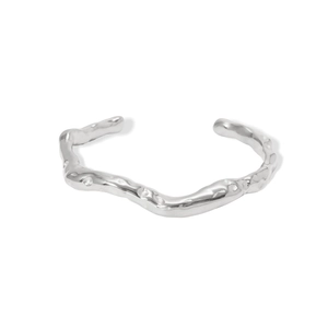 Polished silver stainless steel bangle with a minimalist organic wave texture and open design