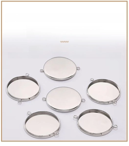 Detailed view of silver stainless steel double-loop round gem tray jewelry connectors