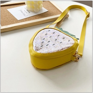 Close-up of yellow strawberry jelly bag featuring star sequins and a transparent window