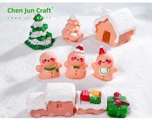 Miniature pink Christmas gingerbread man set with festive resin trees and small house decor