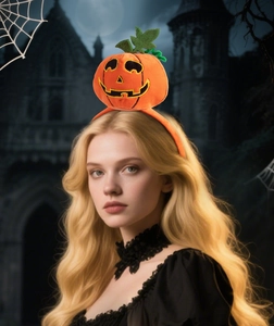 Detail of plush orange pumpkin headband with embroidery for Halloween party costumes