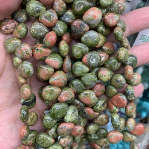 Macro shot of polished unakite teardrop beads for DIY jewelry and hairpins
