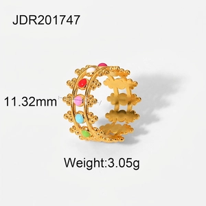Detail of 18K gold plated hollow floral ring with colorful enamel inlay patterns