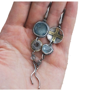 Asymmetric vintage tribal earrings with sky blue stones and metallic cross charms