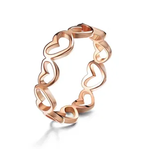 Rose gold minimalist stainless steel ring with hollow heart-shaped continuous pattern