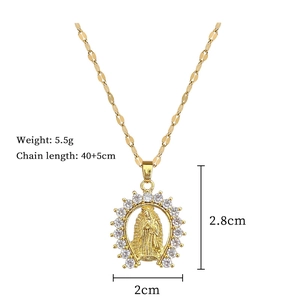 Close-up of Virgin Mary pendant with cubic zirconia inlay on a golden chain necklace