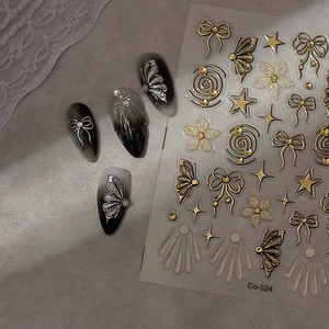 3D butterfly and bow nail stickers with gold texture on black and grey gradient nails
