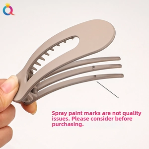 Detail of matte gray large hair clip showing durable inner teeth and spring mechanism