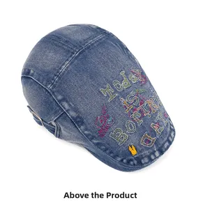 Detailed embroidery of Today Is Boring Day text on a washed blue denim flat cap