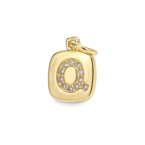 Macro shot of gold square letter Q pendant with cubic zirconia inlay and jump ring