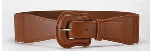 Detail of a brown elastic waist belt with an irregular faux leather buckle and metal pin