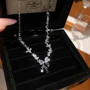 Elegant silver butterfly pendant necklace with sparkling cubic zirconia on black velvet