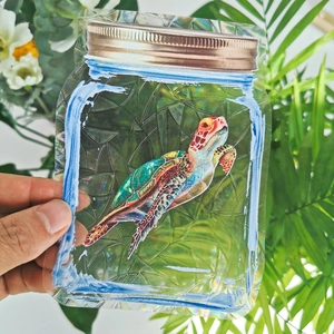 Rainbow suncatcher window decal featuring a colorful sea turtle in a mason jar design