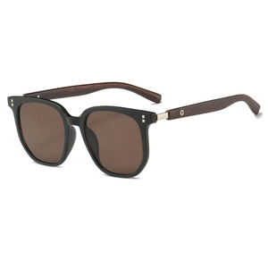 Detail view of vintage polygonal sunglasses featuring solid wood temples and metal hinges