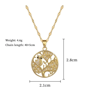 Detailed view of golden owl pendant necklace with measurements and sparkling rhinestones