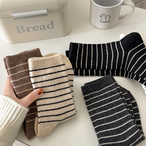 Set of four striped wool crew socks in brown, beige, black, and grey for autumn and winter