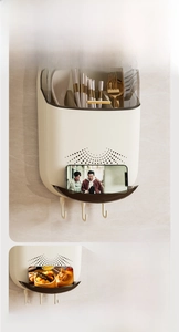 Detail of wall-mounted kitchen organizer with transparent lid and drainage system