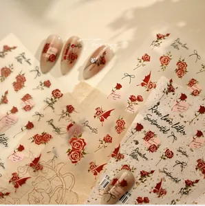 Detail of vintage French rose nail stickers with black ribbon bows and elegant scripts