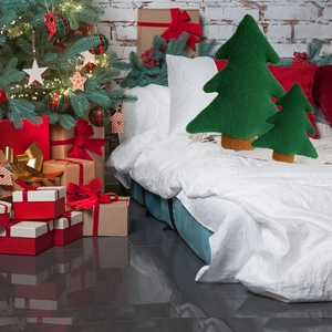 Set of two green plush Christmas tree pillows in fleece fabric for holiday home decor