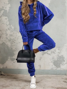 Close-up of royal blue velvet tracksuit featuring soft hoodie texture and ribbed cuffs