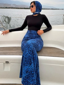 Three-piece leopard print set with long sleeve top, maxi skirt and matching headscarf