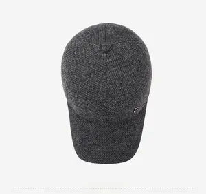 Top down view of a winter grey wool baseball cap with a metal logo detail