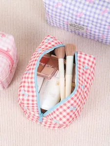 Quilted checkered makeup bags with blue bow accents for large capacity storage