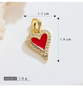 Macro detail of red heart pendant with dimensions showing width 1.1 cm and height 1.9 cm