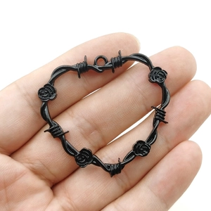 Gothic heart pendant with thorny wire and rose details in antique silver finish