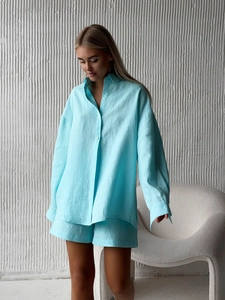 Light blue linen two-piece set featuring long sleeve button shirt and matching shorts