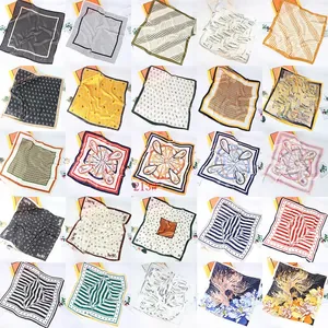 Collection of 25 vintage pattern satin square scarves with various artistic prints