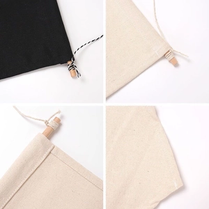 Close-up of canvas pin banner textures with wooden poles and neat stitching details