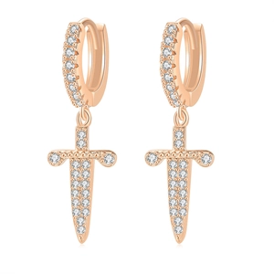 Macro shot of rose gold dagger drop earrings with white cubic zirconia pavé setting