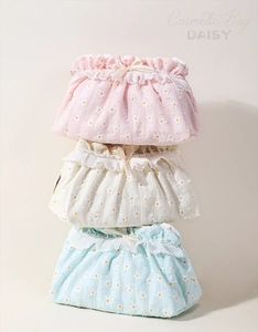 Detailed macro of fabric texture and lace trim on these daisy drawstring cosmetic bags