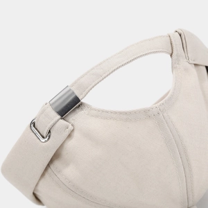 Detail of adjustable metal buckle and high-density cotton strap on beige docker hat