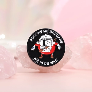 Classic round enamel pin with Mandalorian helmet design and nostalgic video game text