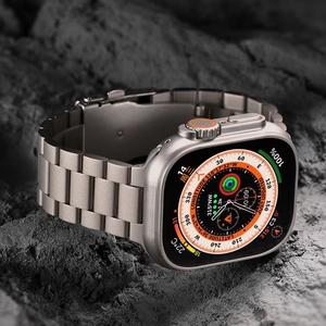 Titanium alloy strap for Apple Watch Ultra featuring a rugged grey rock background