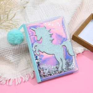 Detail of holographic unicorn notebook cover with moving sequins and plush blue trim