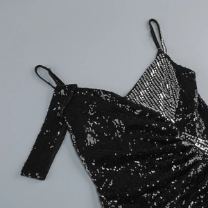 Detail of silver rhinestone neckline and sequins on black evening sling dress