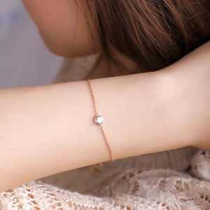Minimalist 18k rose gold plated titanium steel bracelet with a single round diamond charm