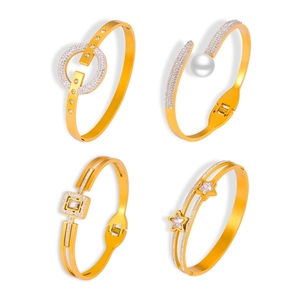 Four styles of gold plated titanium steel bracelets with geometric and cutout designs