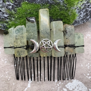 Detailed close-up of natural green crystal hair comb with moon pentagram ornament