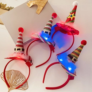 Detail of light-up Christmas headband collection with colorful striped mini elf hats