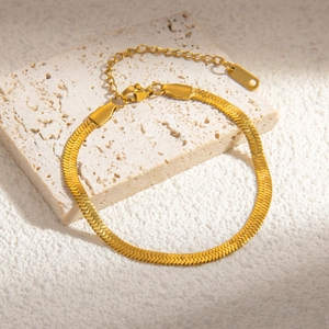Detail showing 18k gold plated flat snake chain texture with adjustable lobster clasp
