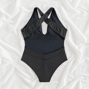 Elegant black one-piece swimsuit with crisscross back, deep V-neck, and ribbed texture